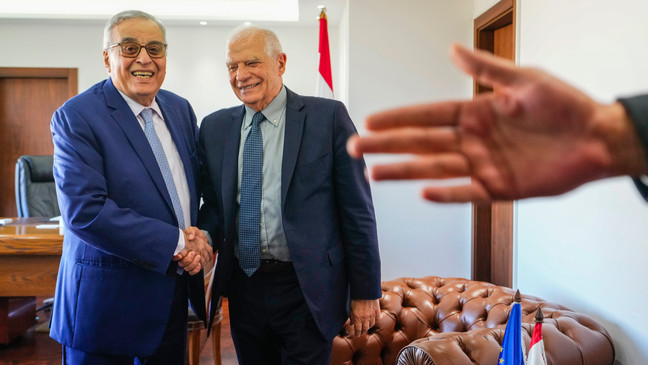 Lebanese Foreign Minister Abdallah Bouhabib, left, shakes hands with European Union foreign policy chief Josep Borrell before their meeting in Beirut, Lebanon, Saturday, Jan. 6, 2024. (AP Photo/Hassan Ammar)