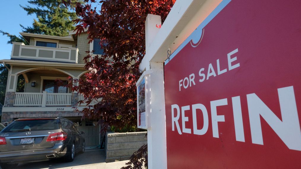 A Redfin real estate yard sign is pictured in front of a house for sale on October 31, 2017 in Seattle, Washington. (Photo by Stephen Brashear/Getty Images for Redfin)