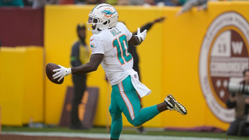 Miami Dolphins wide receiver Tyreek Hill (10) celebrates after scoring against the Washington Commanders during the first half of an NFL football game Sunday, Dec. 3, 2023, in Landover, Md. (AP Photo/Mark Schiefelbein)