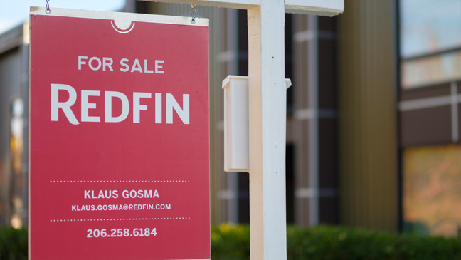 SEATTLE, WA - OCTOBER 31: A Redfin real estate yard sign is pictured in front of a house on October 31, 2017 in Seattle, Washington. Seattle has been one of the fastest and most competitive housing markets in the United States throughout 2017. (Photo by Stephen Brashear/Getty Images for Redfin)