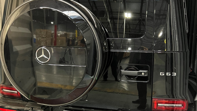 The dealer plate remains on a stolen Mercedes. (7News)